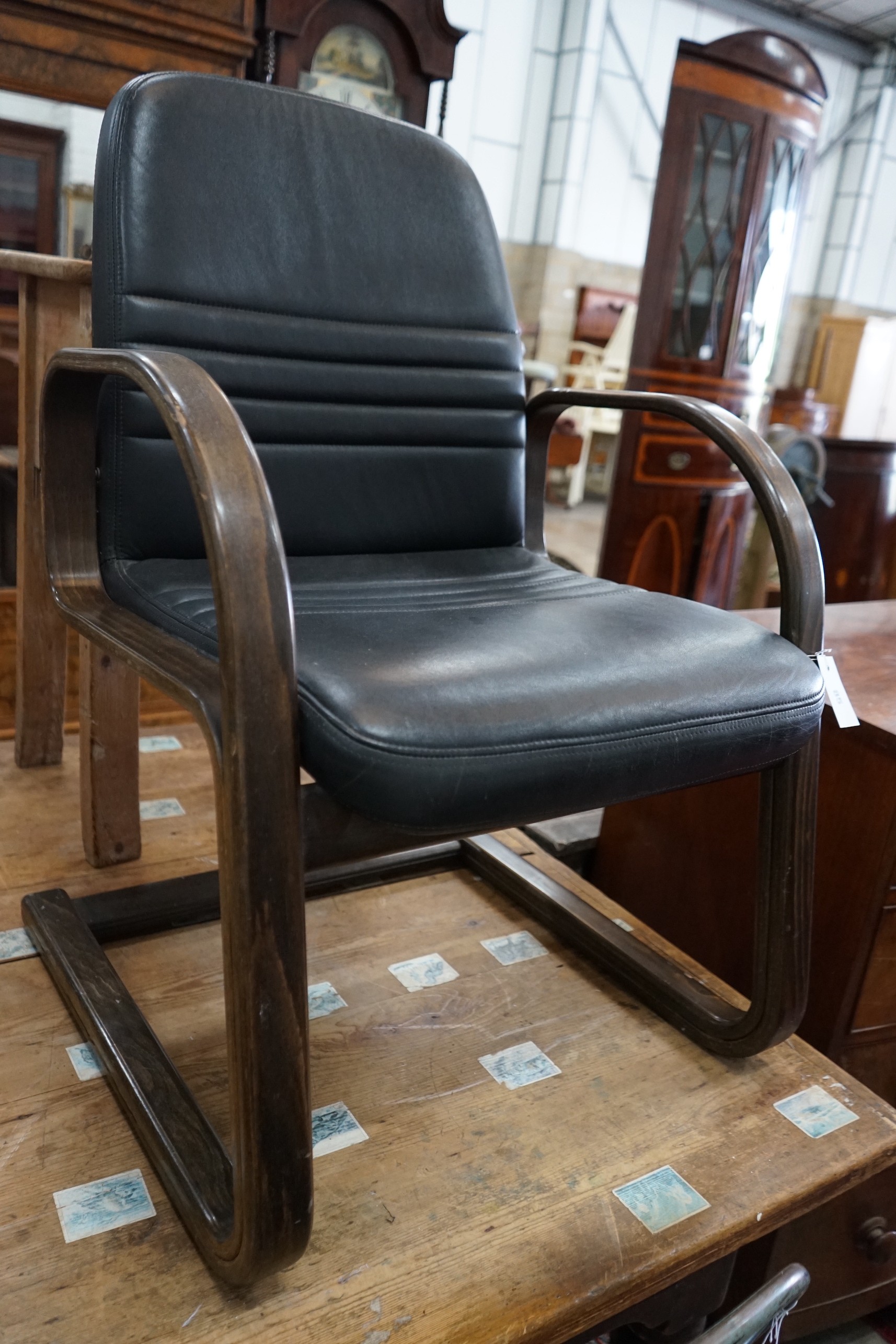 A pair of Sedus cantilever chairs, wood and black leather, width 60cm, depth 54cm, height 90cm